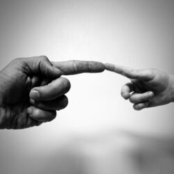 Idly digging his toes in the sand